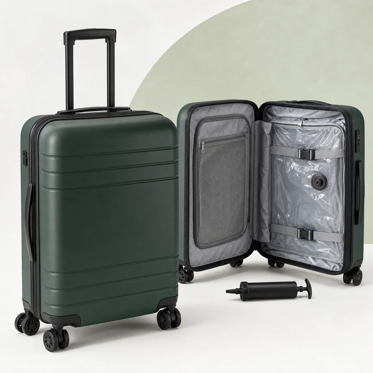 Green hard-shell carry-on luggage with an internal vacuum compression compartment and removable hand pump